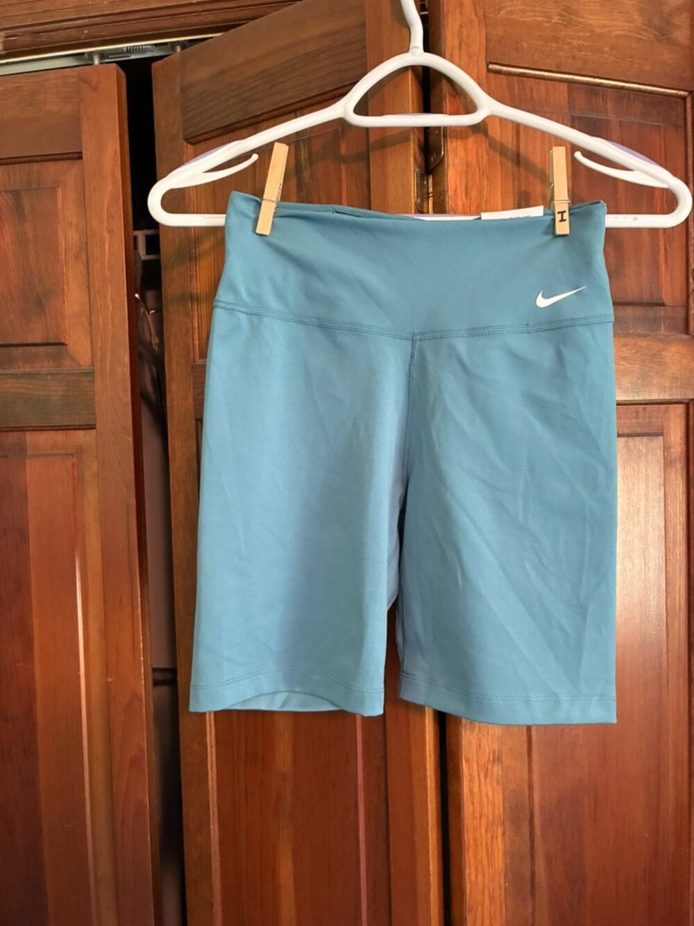 Nike Dri Fit Size XS tight fit mid rise blue bike shorts (New with tags)